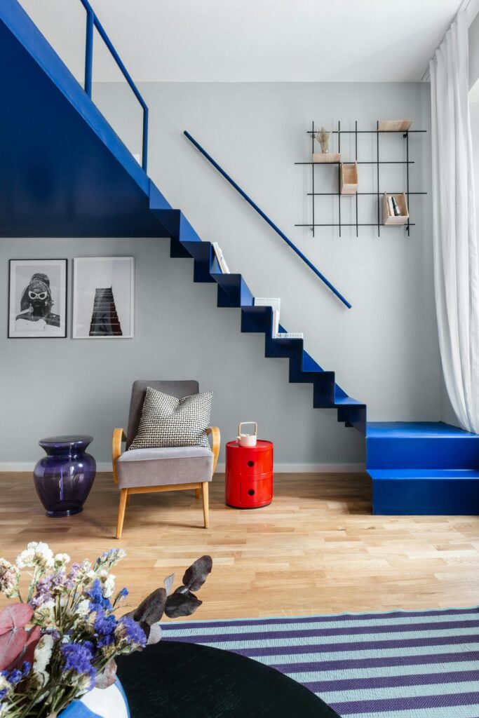 Contemporary room with blue staircase